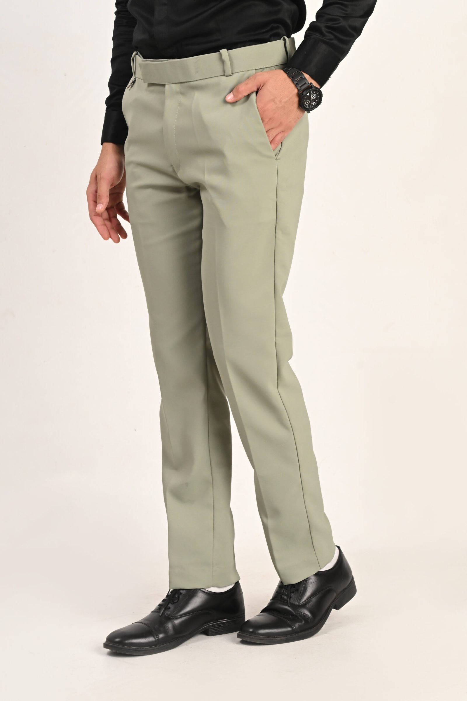 FHUZANA pista green men's formal trouser with a smart tailored fit, neat stitching and elegant design.